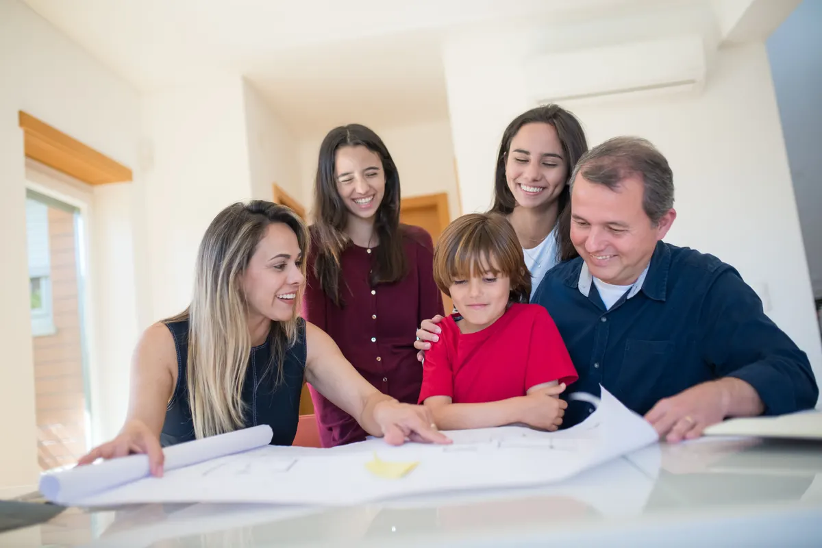 A family looking over paperwork together at a table