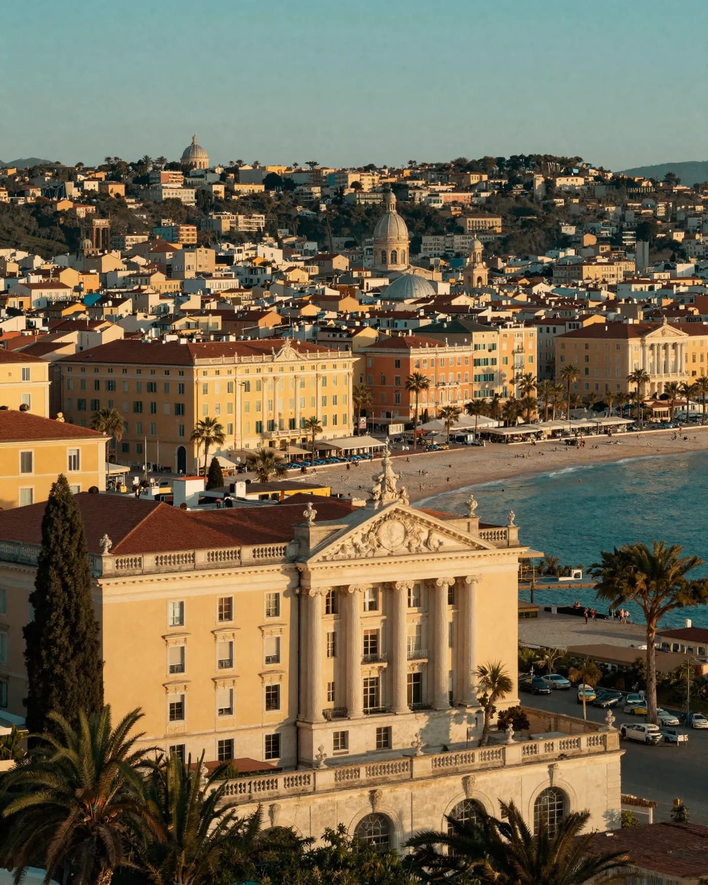 Golden-hour view over a European coastal city