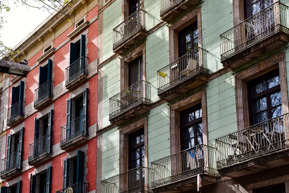 Balconied apartment facades on a Spanish street